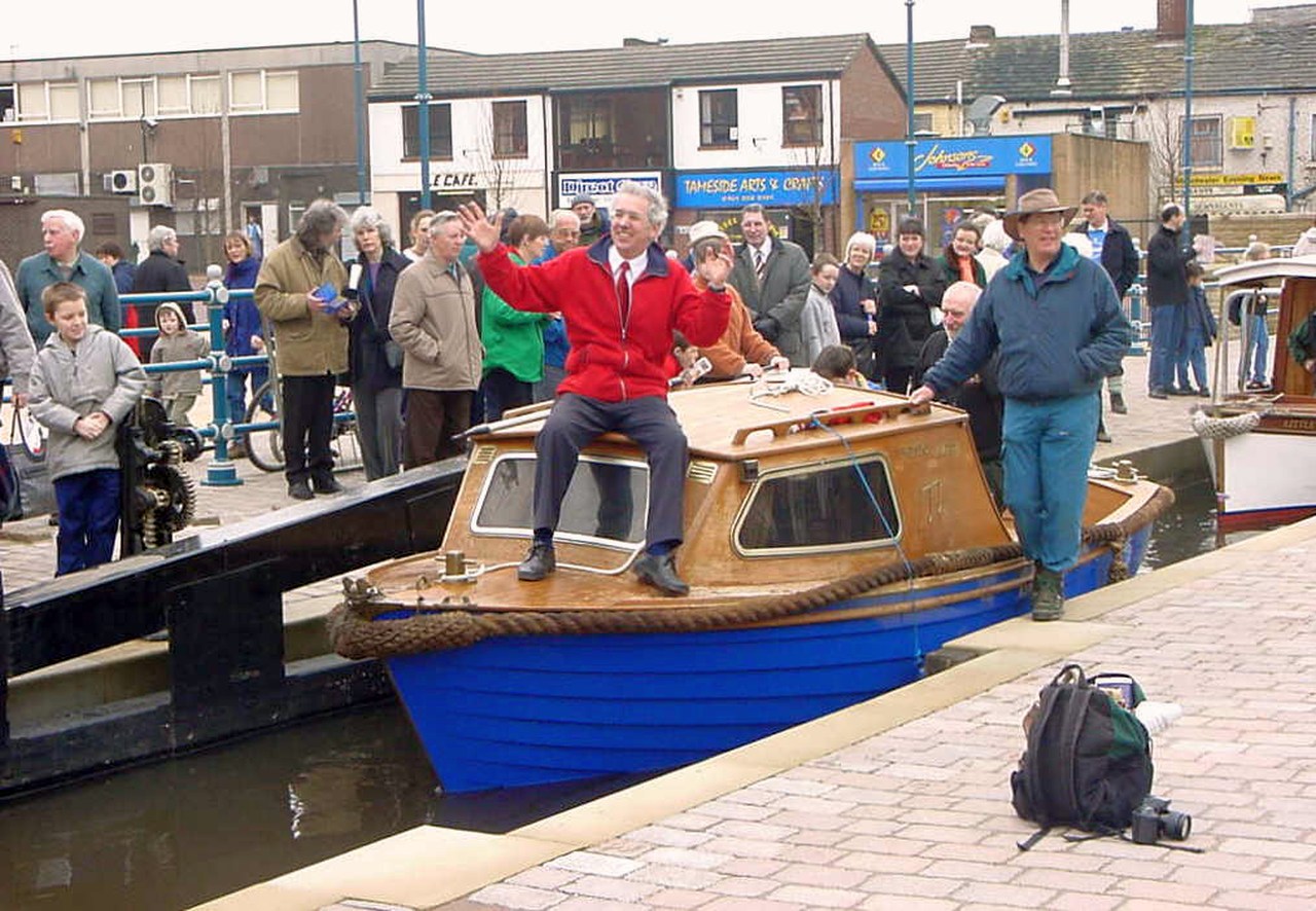David Sumner, Chairman of Huddersfield Canal Society, aboard the first boat into Stalybridge.